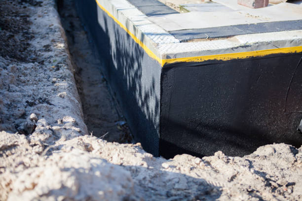 Professional Waterproofing technician working in Dimondale, MI